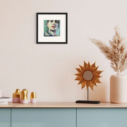 framed self portrait art print of a girl hanging on wall above a desk