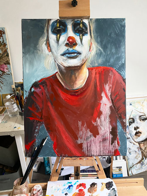 Oil painting self-portrait of a sad girl with clown make-up