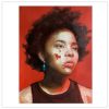 portrait of a Black woman with a green earring